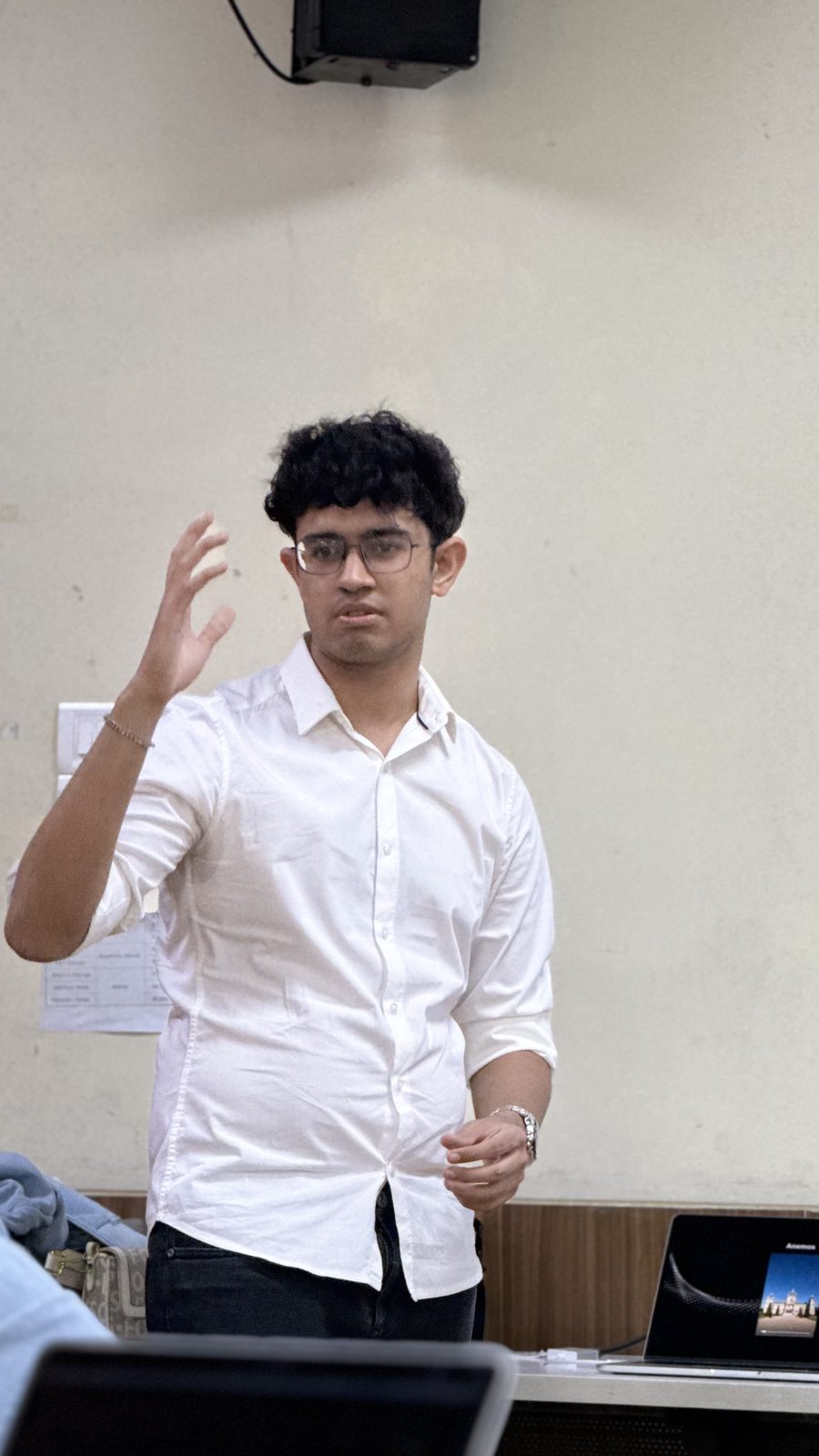 a speaker mid-sentence, talking to the room